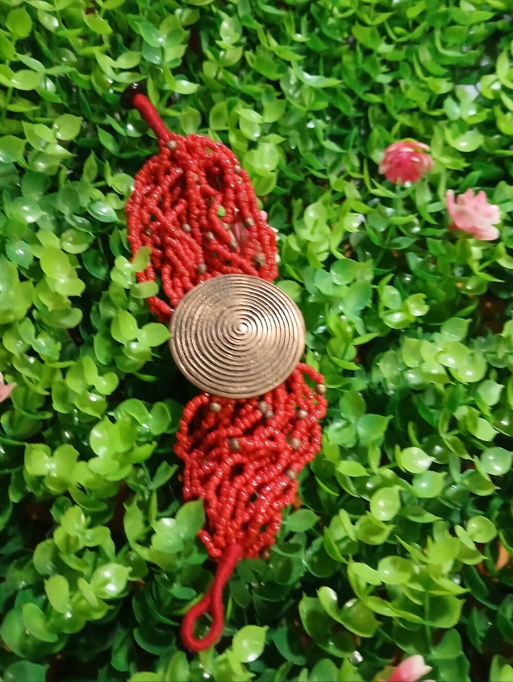 Red Beaded Bracelet with Bronze Center